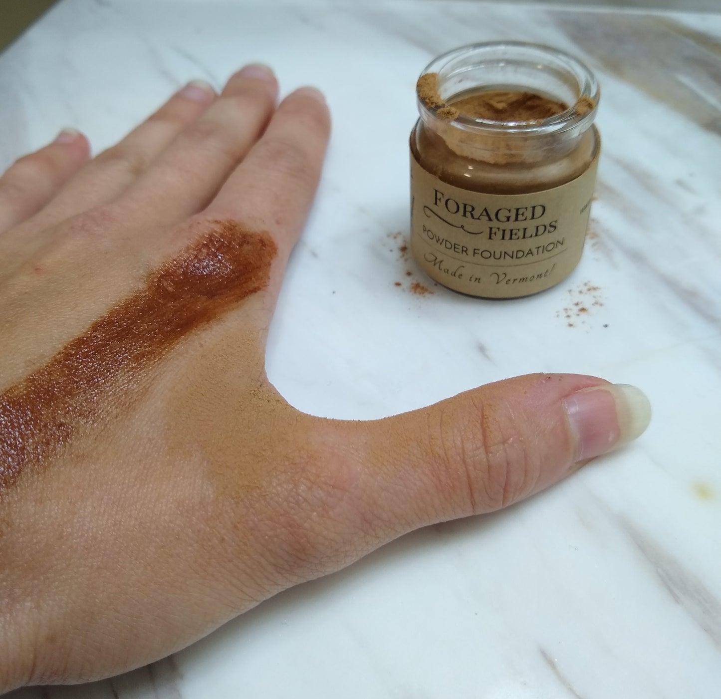 This is my hand with shade 5 applied on top of cream and dry next to it on the right. I am usually a shade 3. I hope this helps you but please order a sample find your shade set before a full size since these are so hard to tell online. These shades darken in person as well so go lighter than you think!